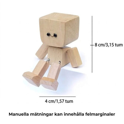 Charmigt litet gungfigur i trä med 12 magnetiska uttryck