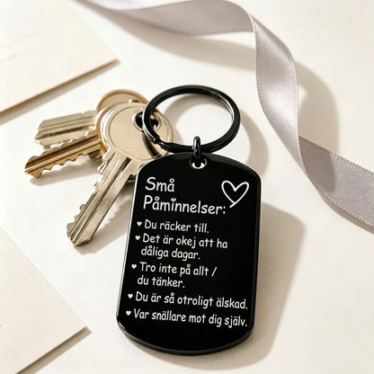 Inspirerande nyckelring med graverad text